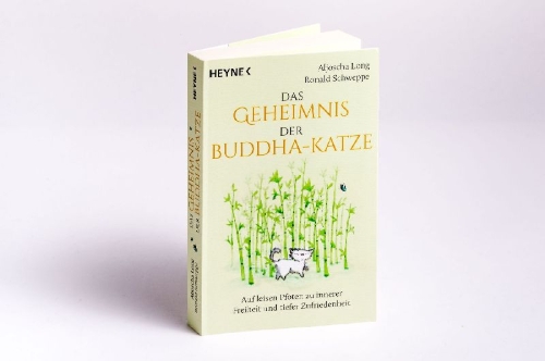 Buchcover und Innenansicht für das Buch: Das Geheimnis der Buddha-Katze